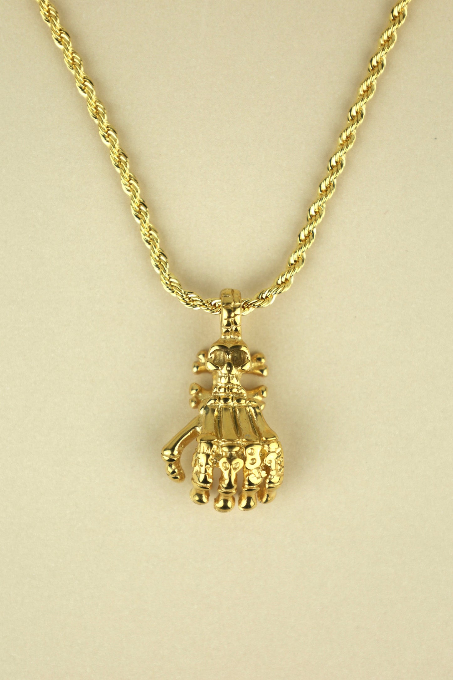 Skeleton Hand necklace in gold