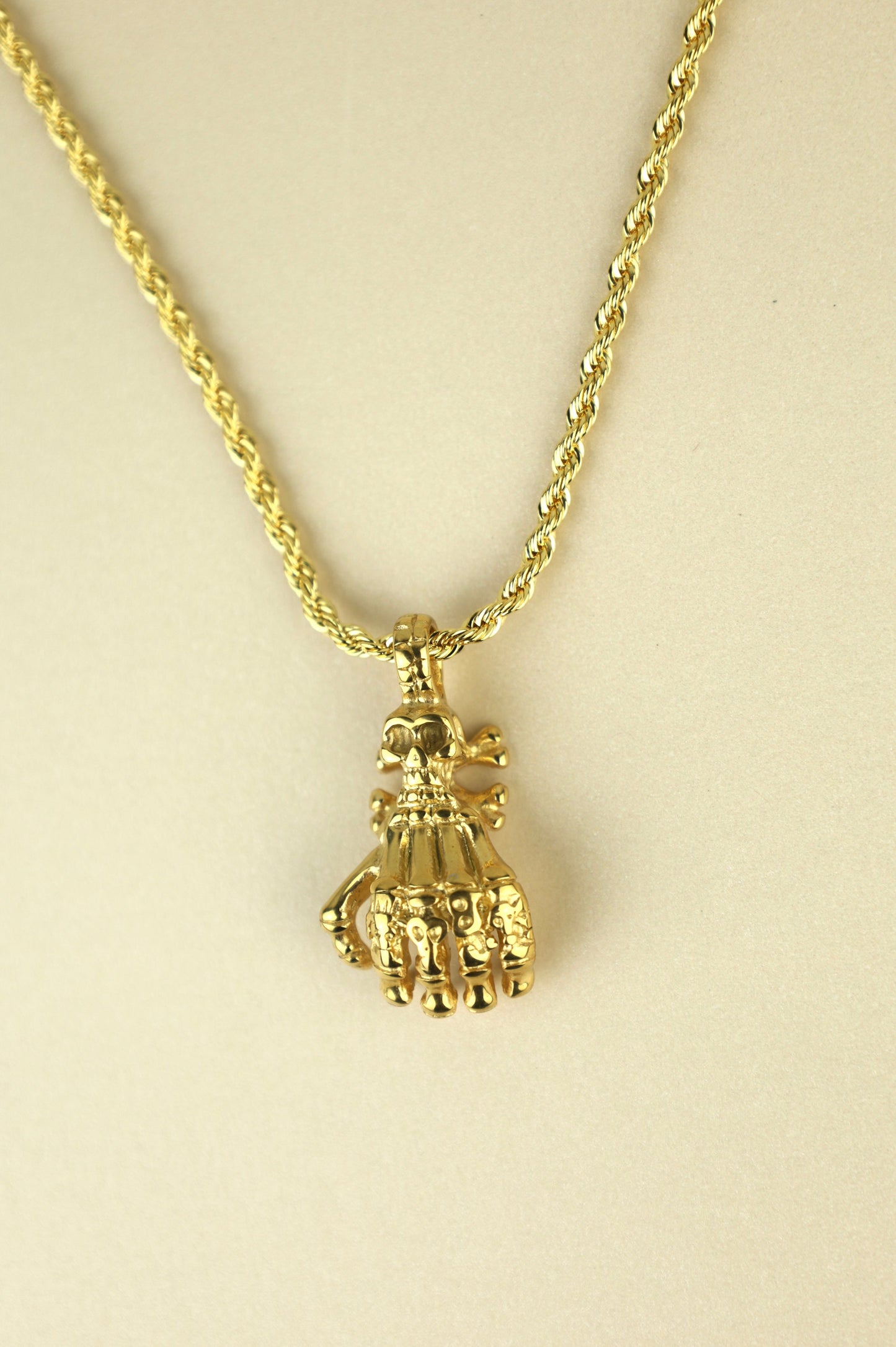 Skeleton Hand necklace in gold