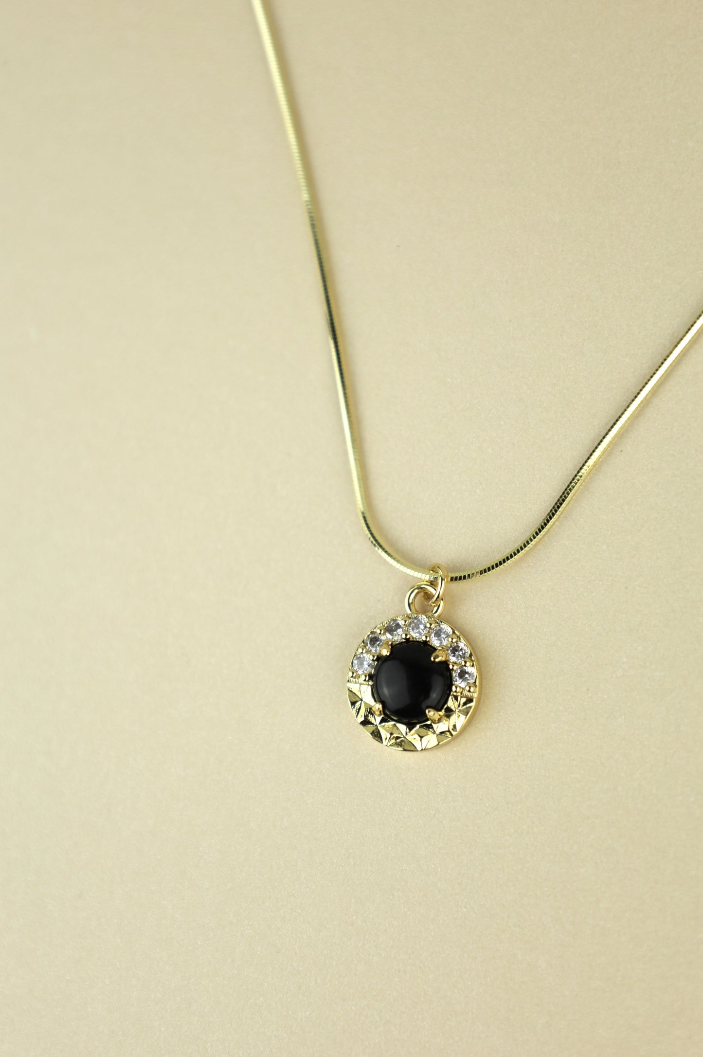 Obsidian necklace in gold