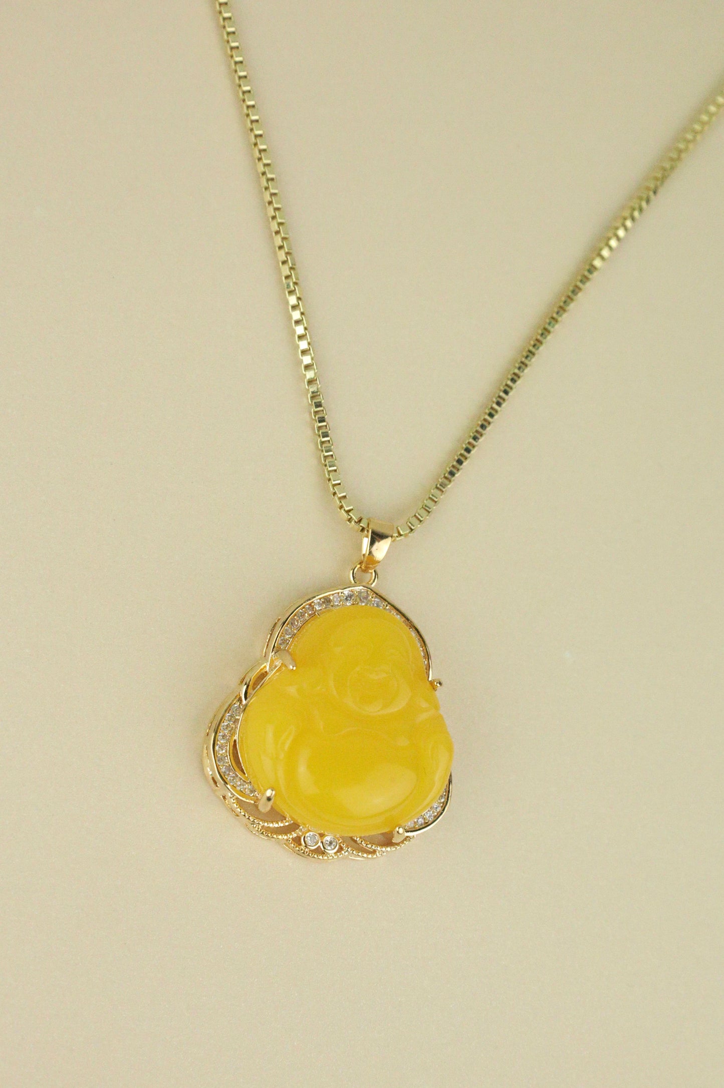 Yellow Buddha necklace in gold