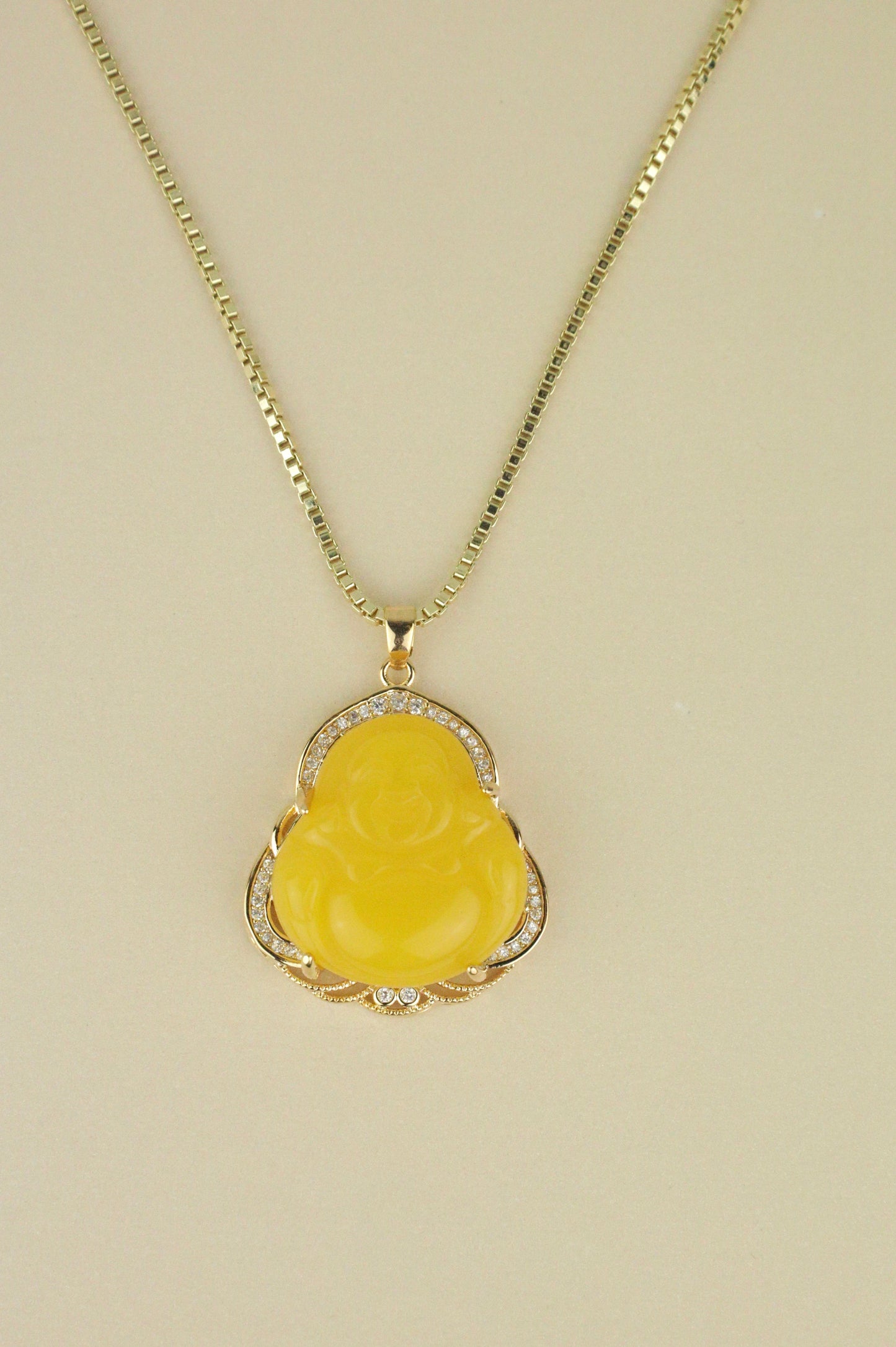 Yellow Buddha necklace in gold