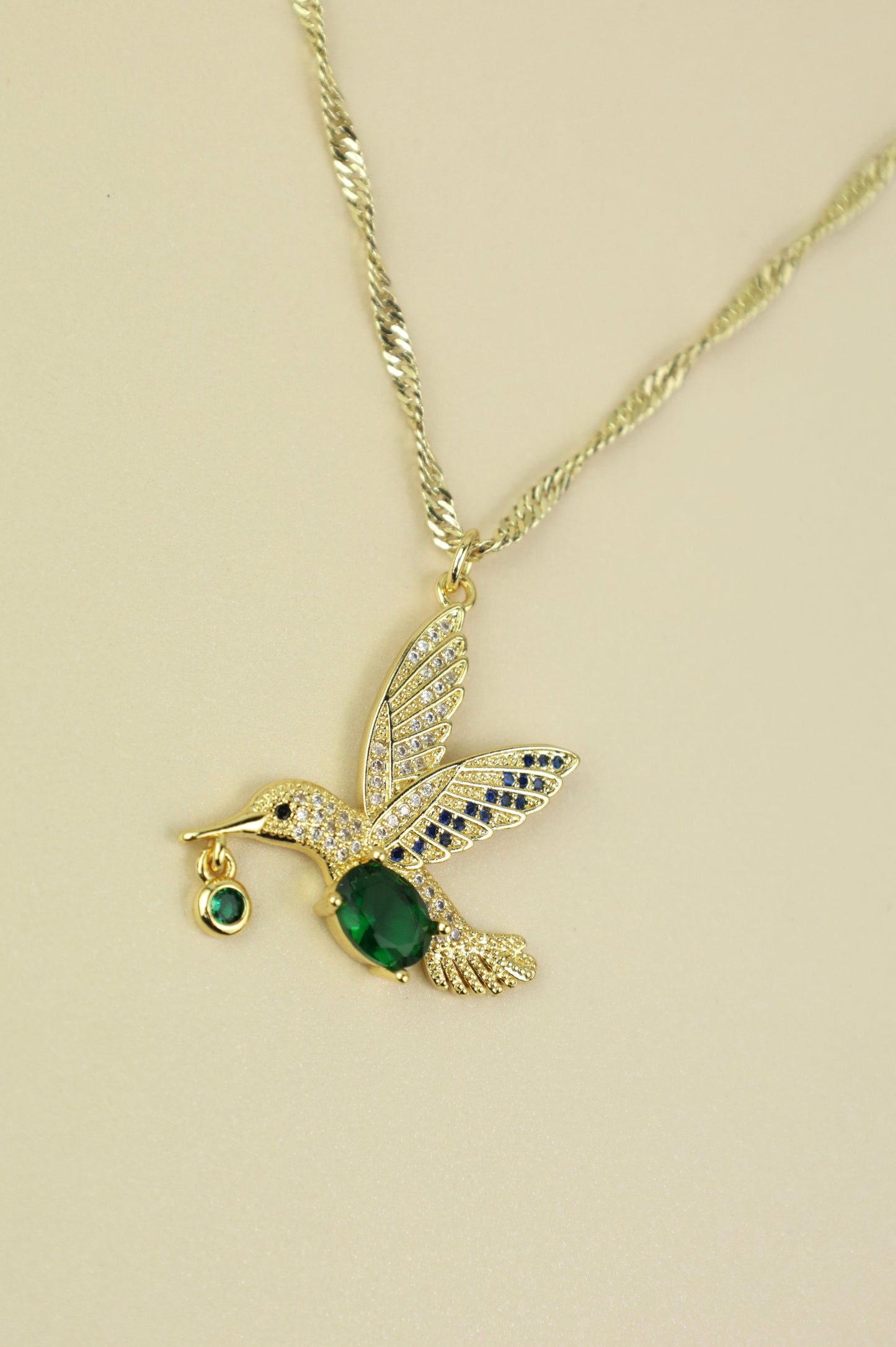 Hummingbird necklace in gold